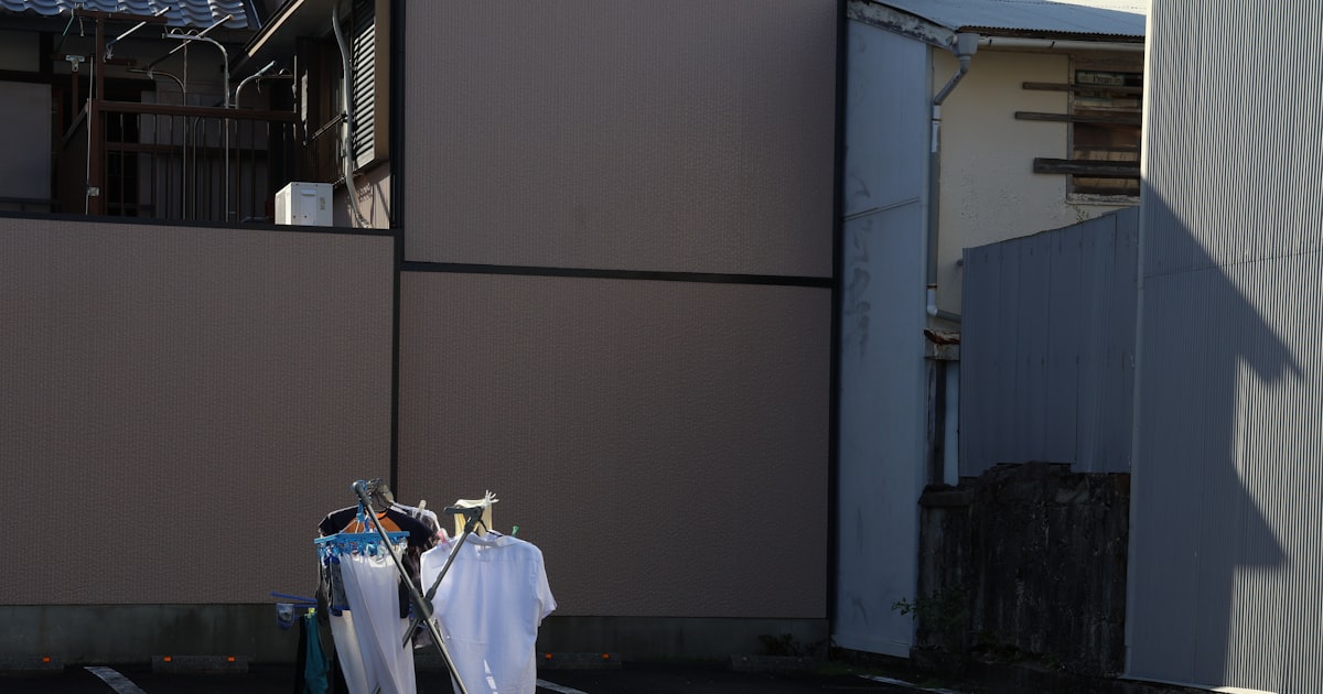Freshly washed clothes drying outdoors on a line in bright, breezy weather